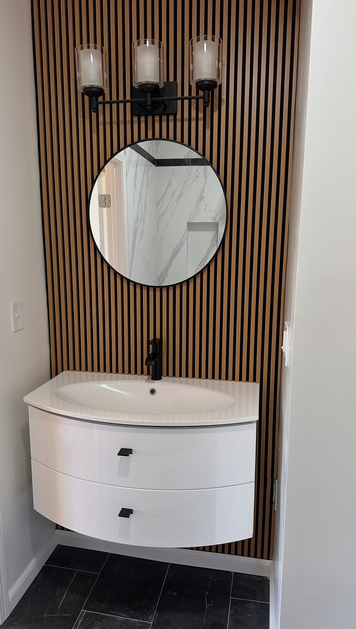 Modern bathroom vanity with wood slat wall