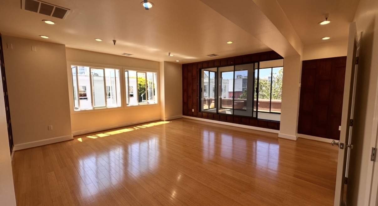 Remodeled living space with hardwood floor
